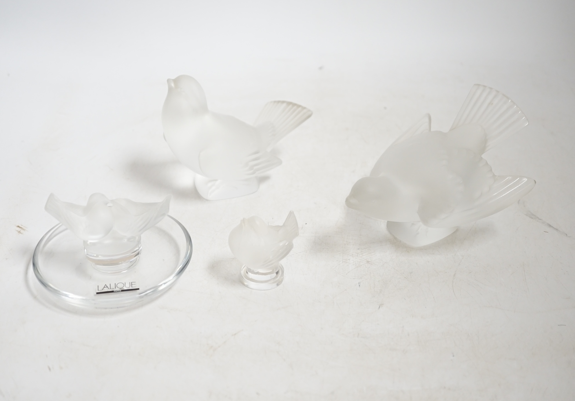 Three modern Lalique glass birds and a similar Lalique dish, each signed, largest 13.5cm wide. Condition - good